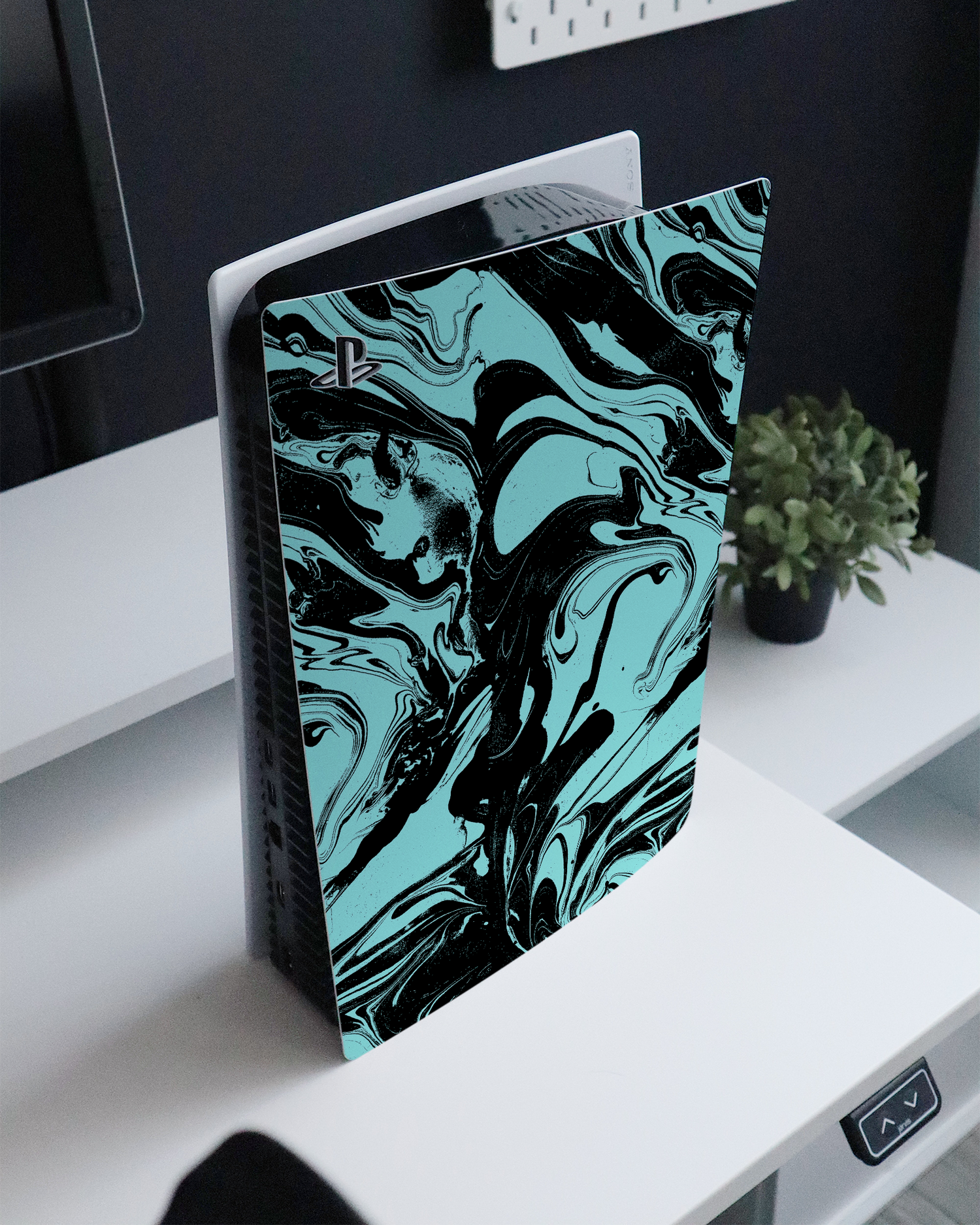 Mint Swirl Console Skin for Sony PlayStation 5 Digital Edition standing on a sideboard 