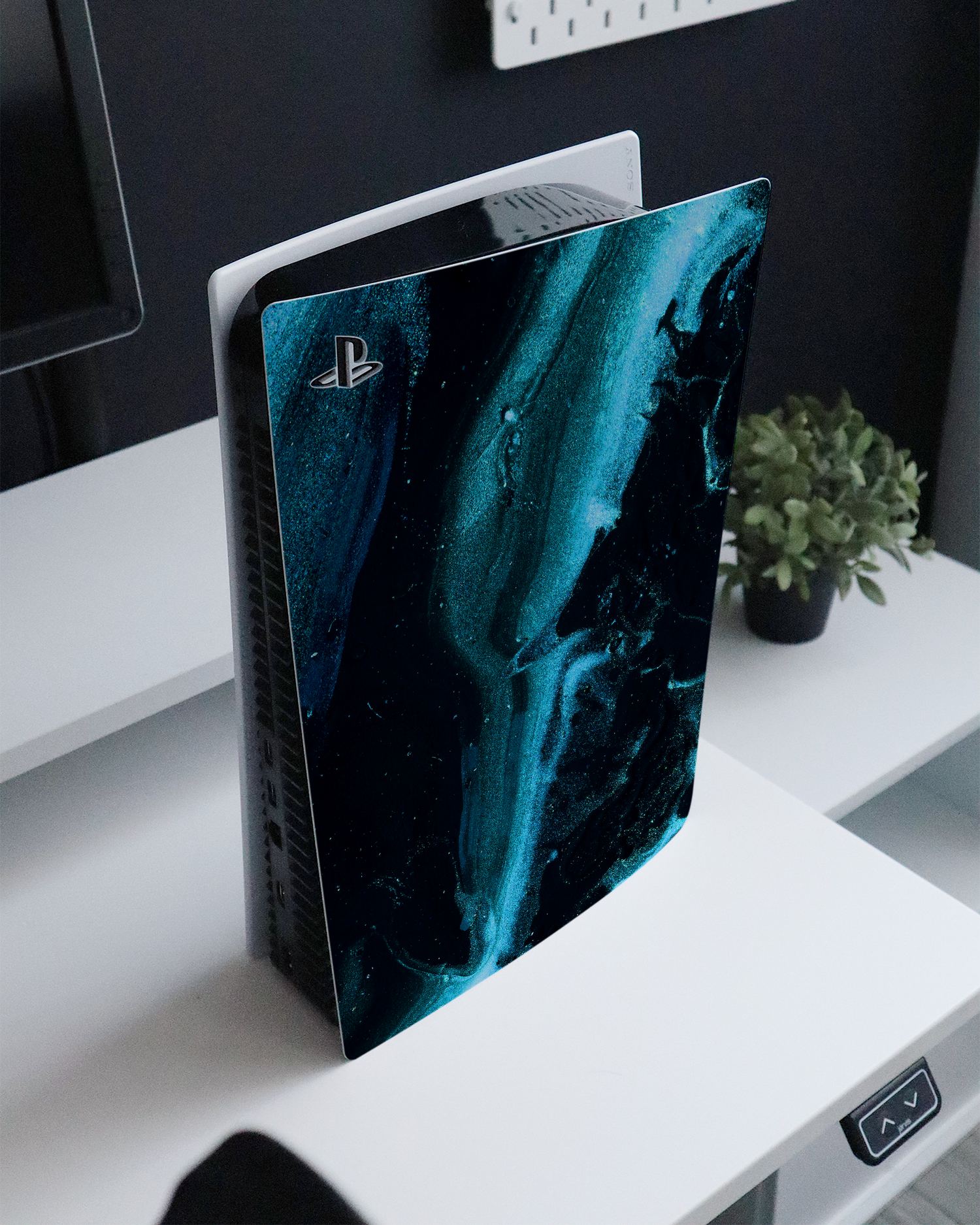 Deep Turquoise Sparkle Console Skin for Sony PlayStation 5 Digital Edition standing on a sideboard 