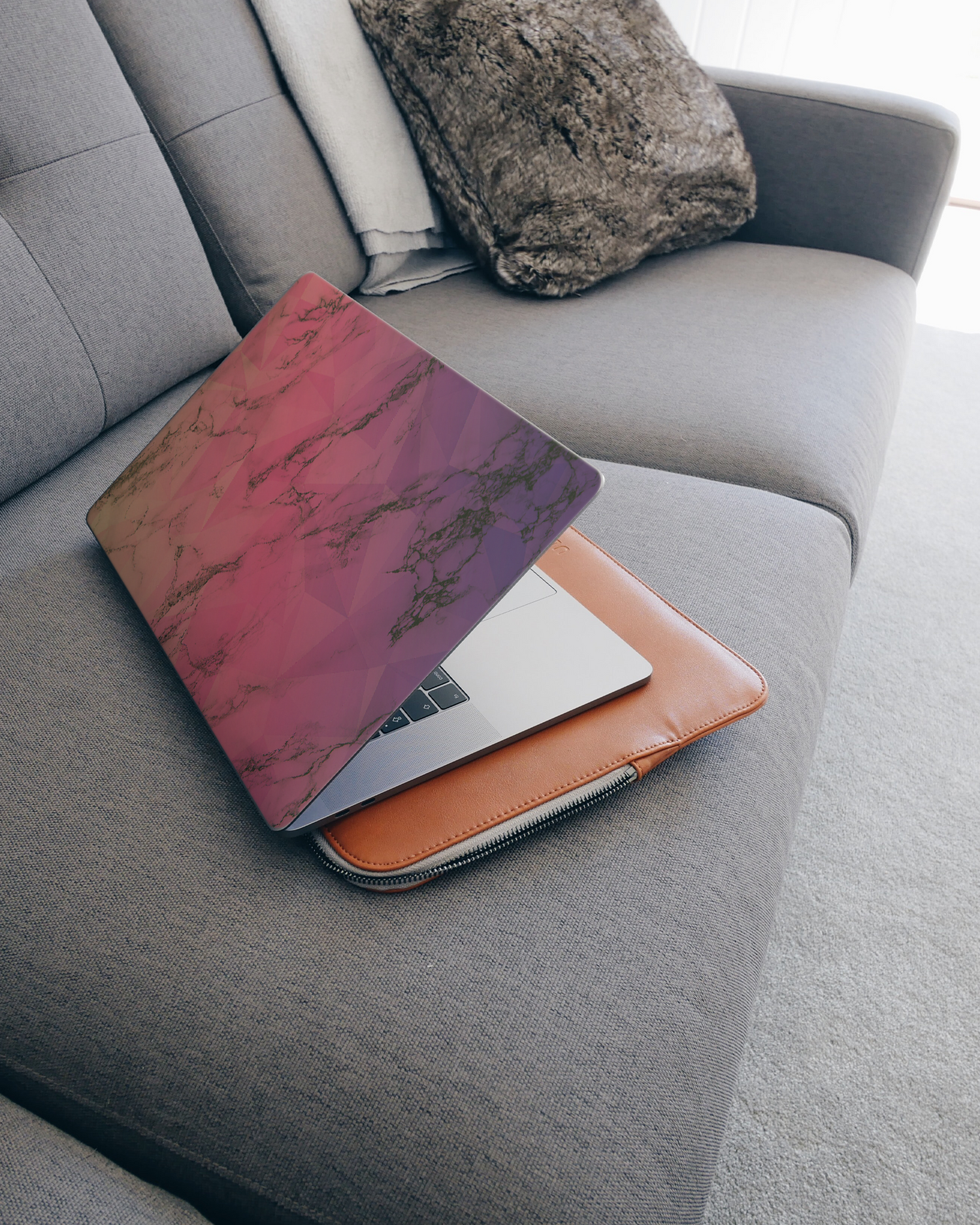 Marbled Triangles Laptop Skin for 15 inch Apple MacBooks on a couch