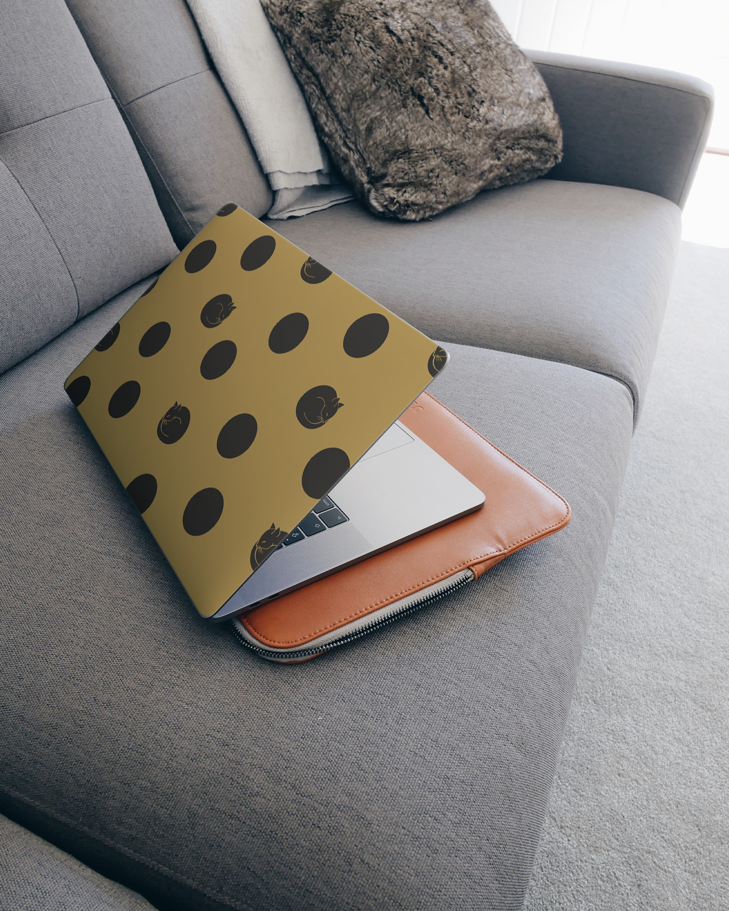 Polka Cats Laptop Skin for 15 inch Apple MacBooks on a couch