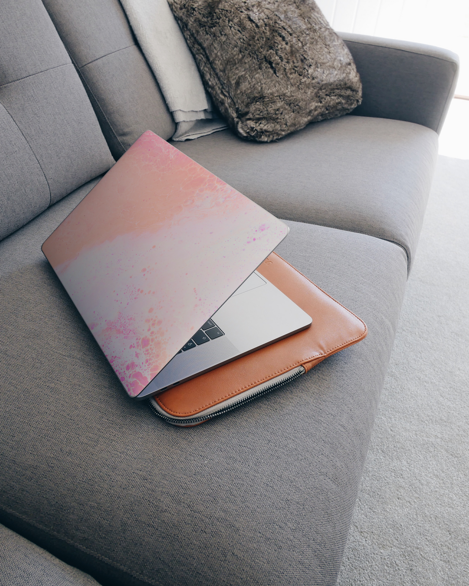 Peaches & Cream Marble Laptop Skin for 15 inch Apple MacBooks on a couch