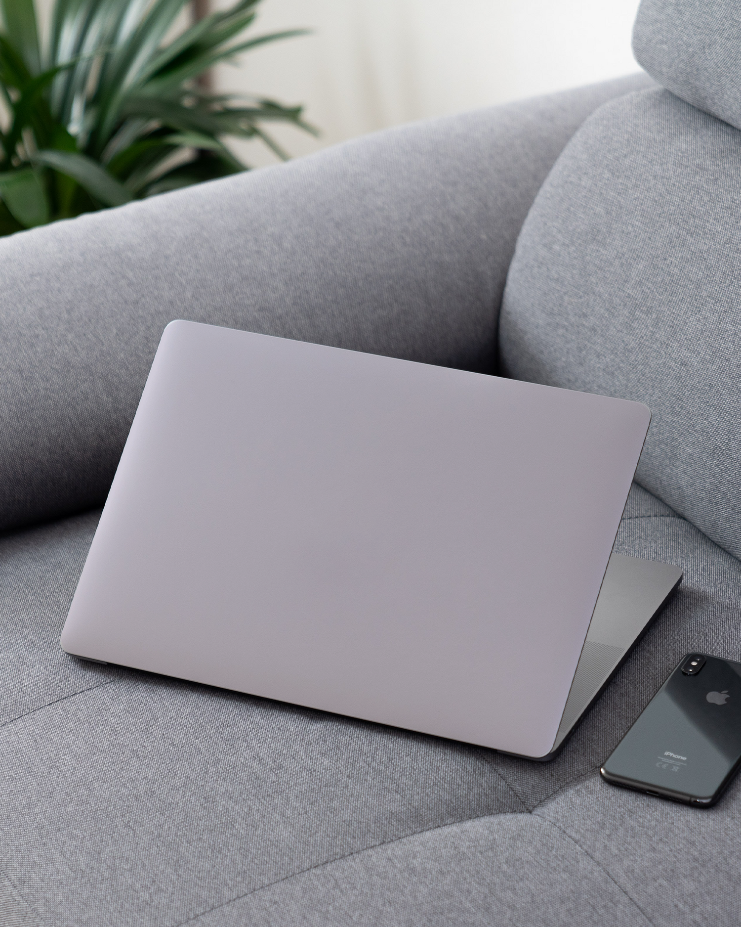 LIGHT PURPLE Laptop Skin for 13 inch Apple MacBooks on a couch