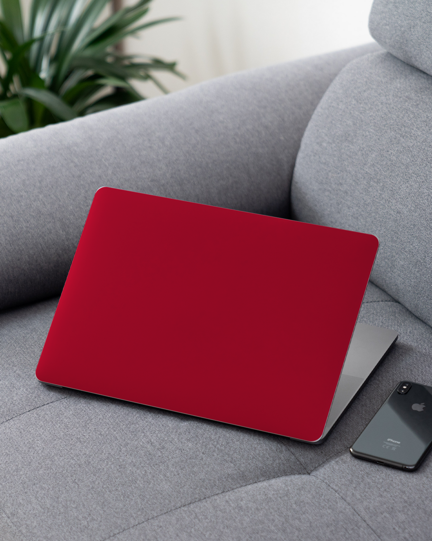 RED Laptop Skin for 13 inch Apple MacBooks on a couch