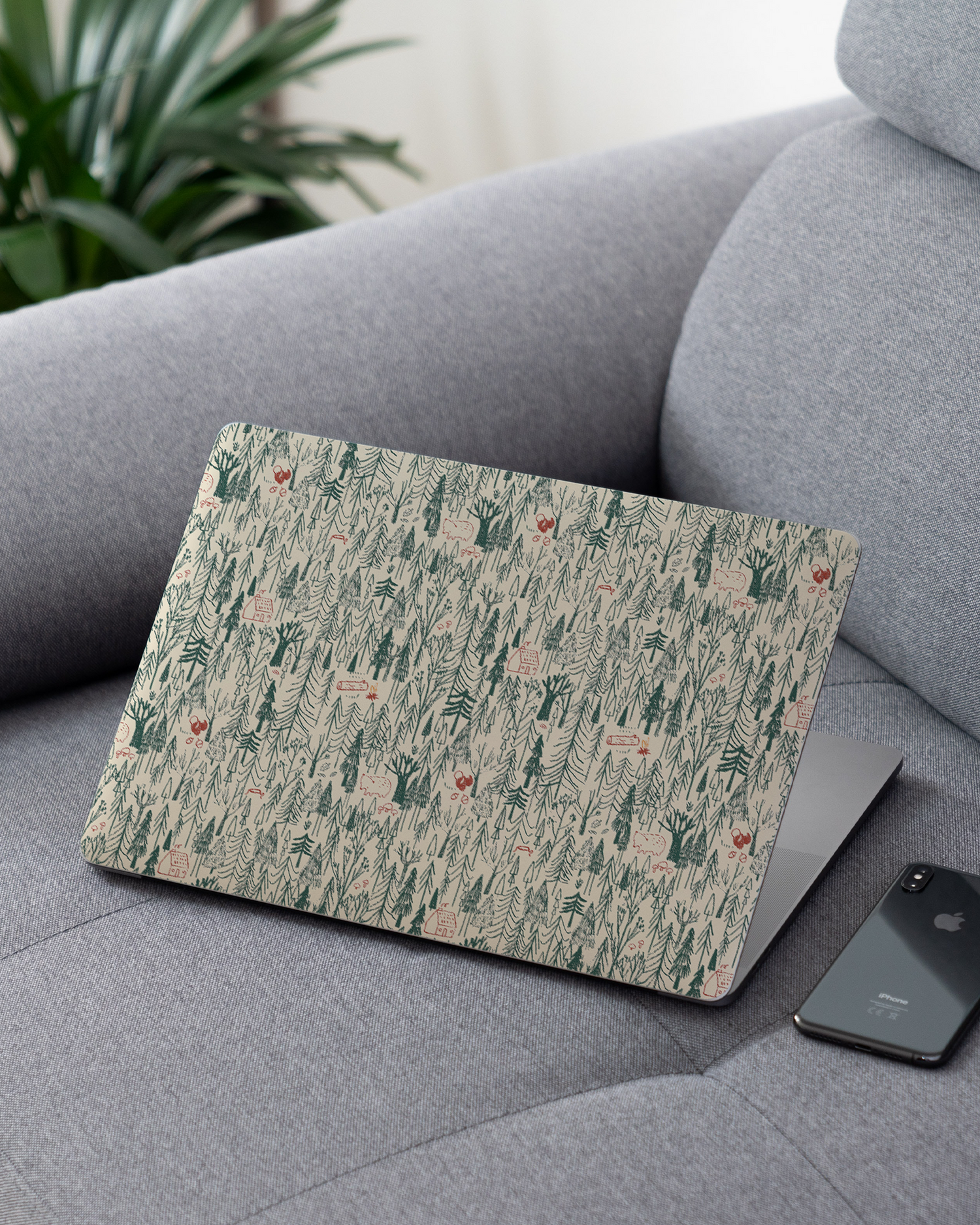 Wonder Forest Laptop Skin for 13 inch Apple MacBooks on a couch